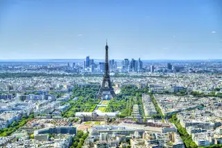 Paris from above with the Eiffel Tower and the towers of La Défense behind