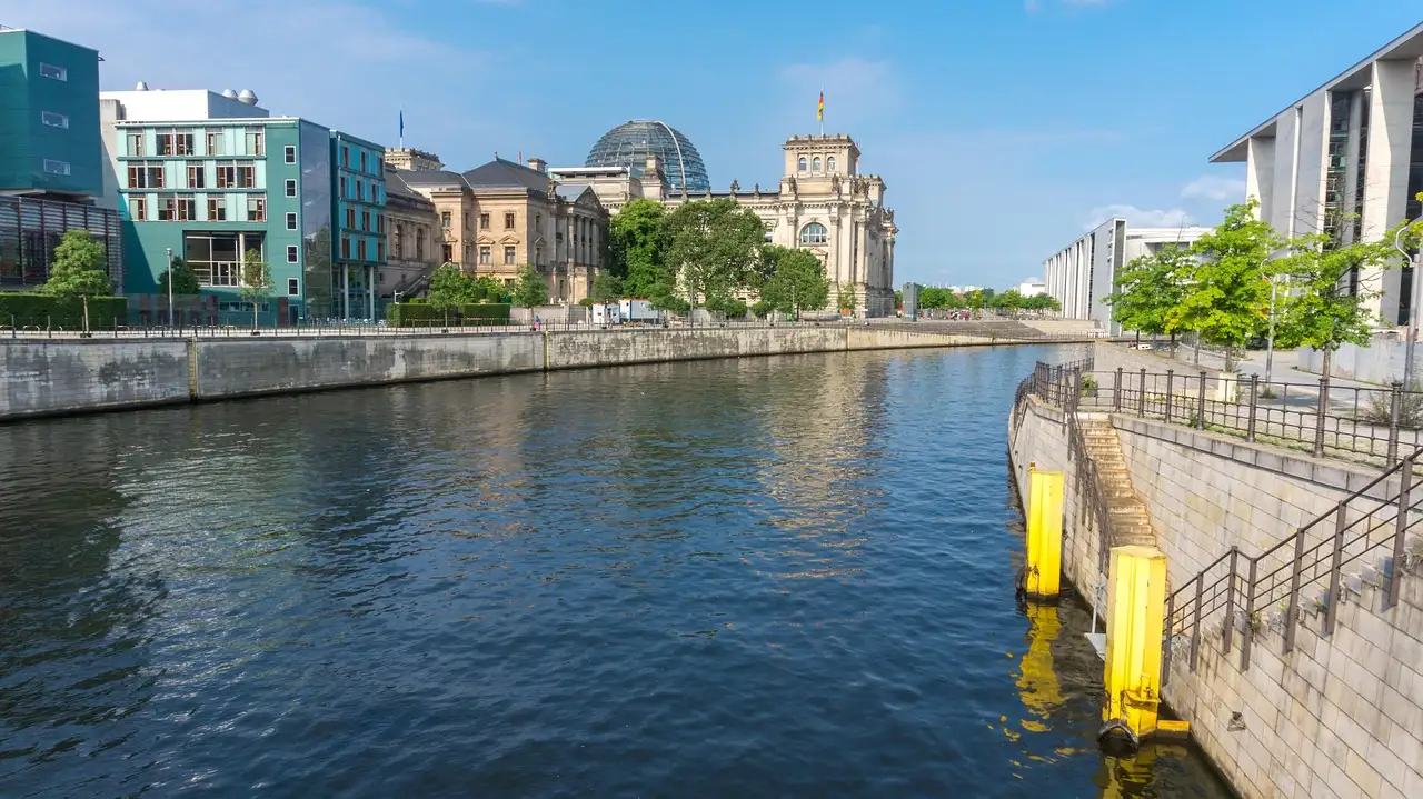 The Spree in the government district, with the Reichstag dome behind modern buildings