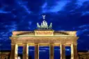 The Brandenburg Gate and its Quadriga lit up at blue hour