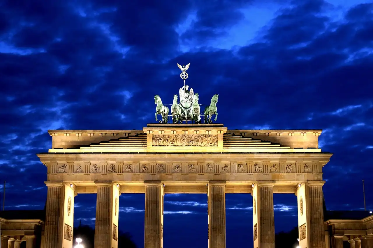 The Brandenburg Gate and its Quadriga lit up at blue hour