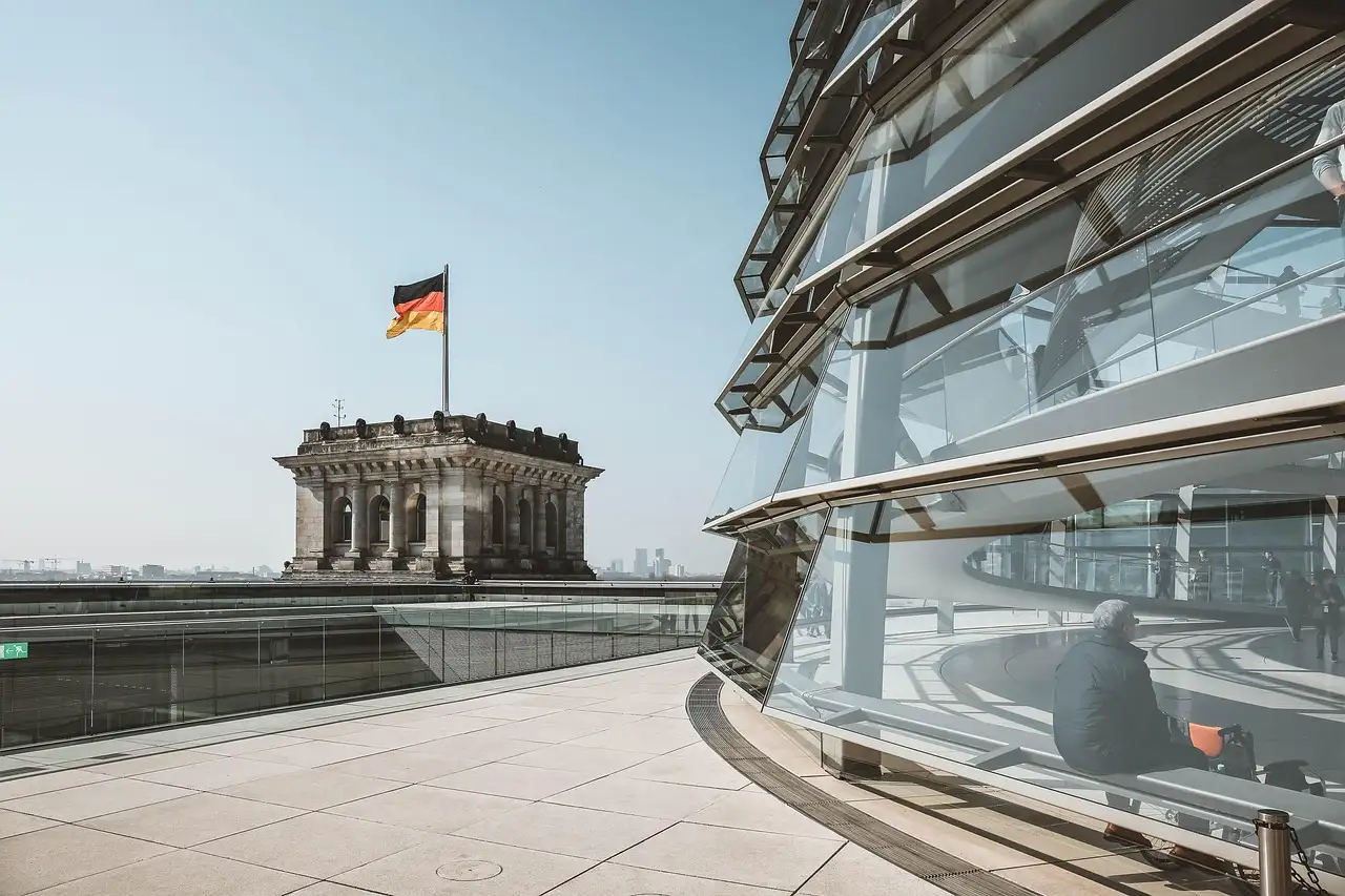 The Reichstag roof terrace, with the glass dome and a corner tower flying the German flag
