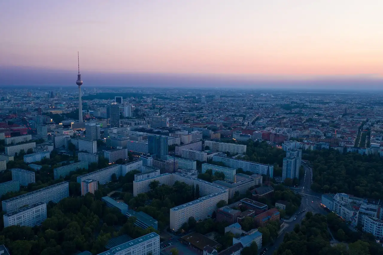 Berlin from high above at dusk, with the TV Tower on the skyline