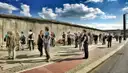 Visitors along a preserved stretch of the Berlin Wall on Bernauer Strasse