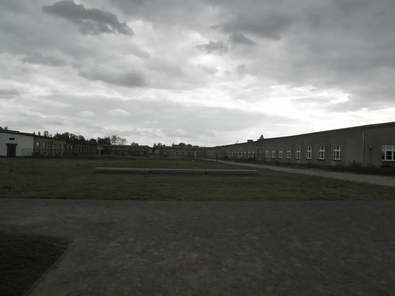 Barrack buildings at the Sachsenhausen Memorial under a grey sky