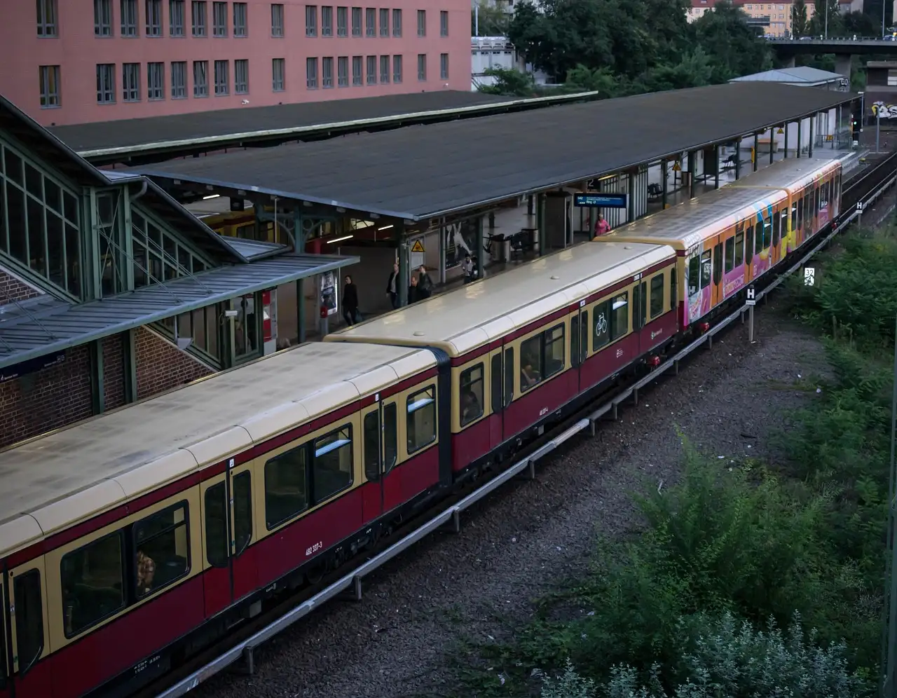 A red and cream S-Bahn train at a Berlin station