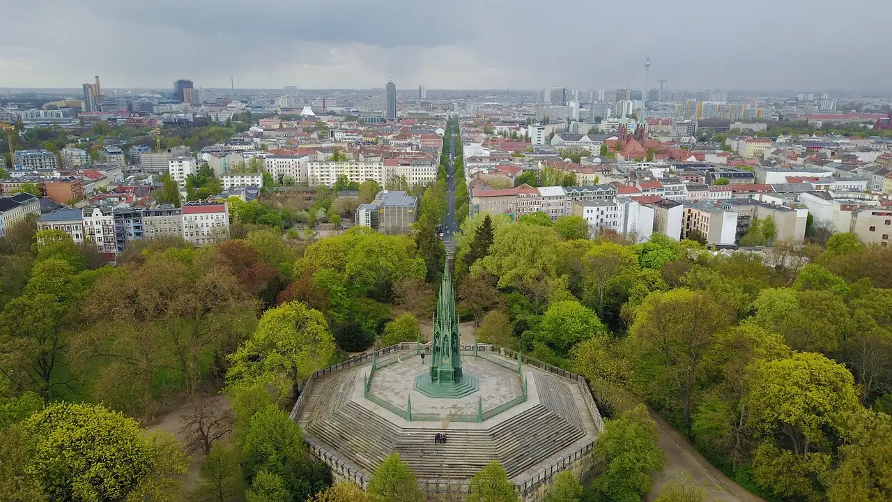 Aerial view of Viktoriapark in Kreuzberg, with its monument among green trees and the city behind