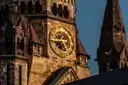 The clock on the old tower of the Kaiser Wilhelm Memorial Church