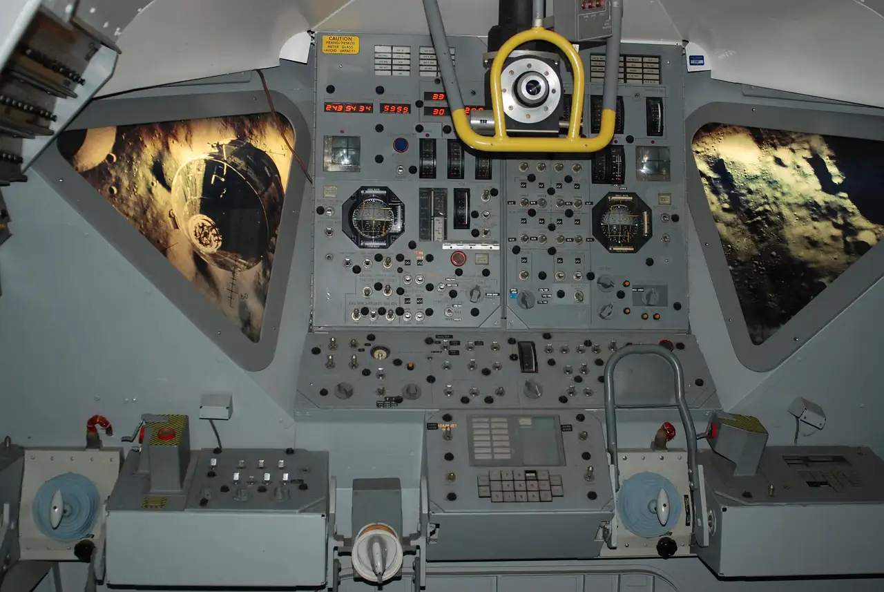 Rows of switches and dials inside an Apollo spacecraft cockpit on display