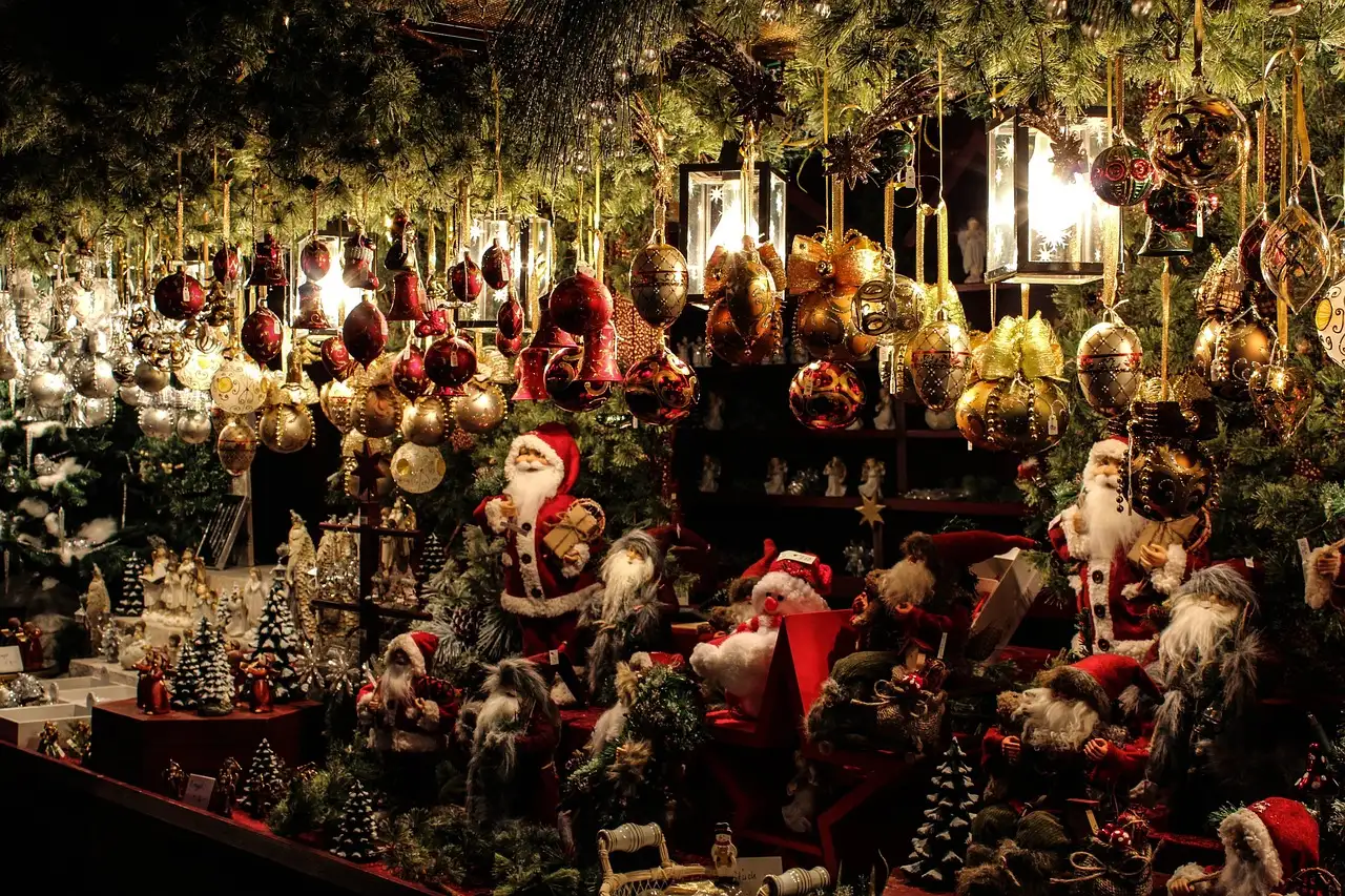 A Christmas market stall full of glass baubles and small Santa figures
