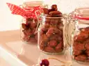Glass jars filled with sugar-roasted almonds