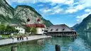 The red-domed church of St. Bartholomä on Lake Königssee, below steep mountains