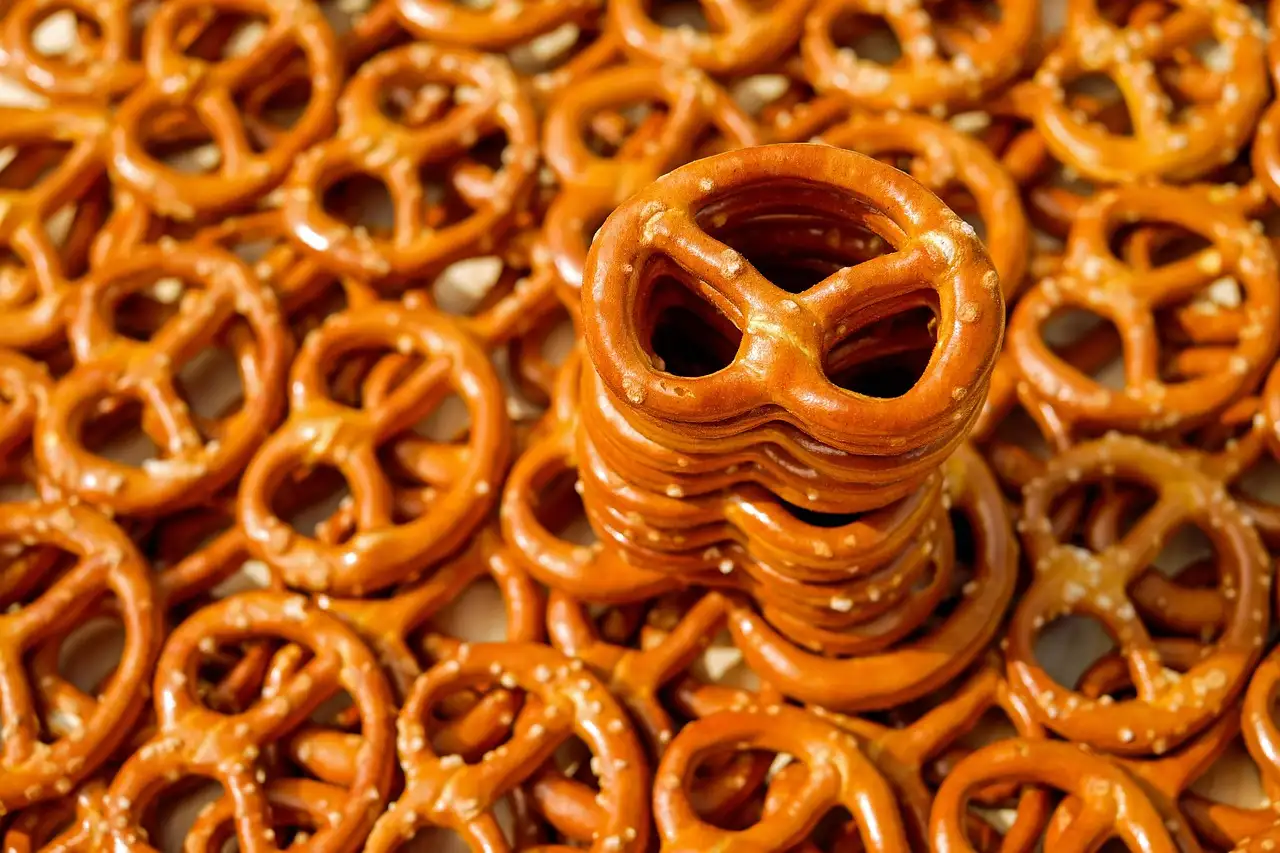 A pile of freshly baked Bavarian pretzels with coarse salt