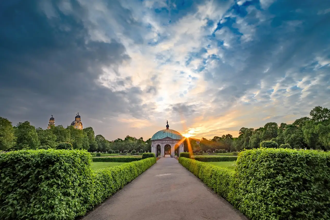 The Diana Temple at the end of a hedge-lined path in the Hofgarten