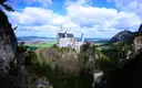 Neuschwanstein Castle on its wooded cliff, seen from across the gorge