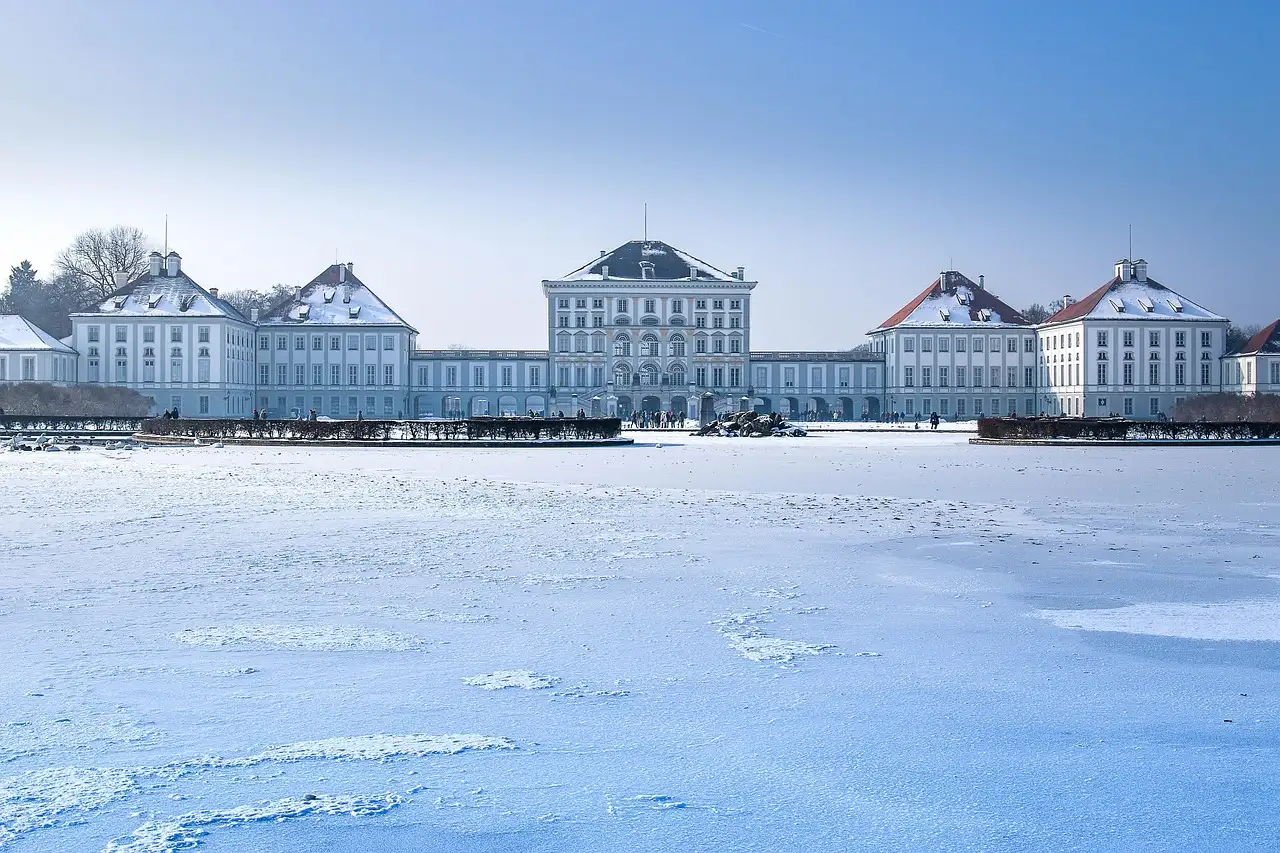 Nymphenburg Palace in winter, with snow on the frozen water in front