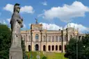 A stone statue in front of the Maximilianeum, the Bavarian parliament building in Munich