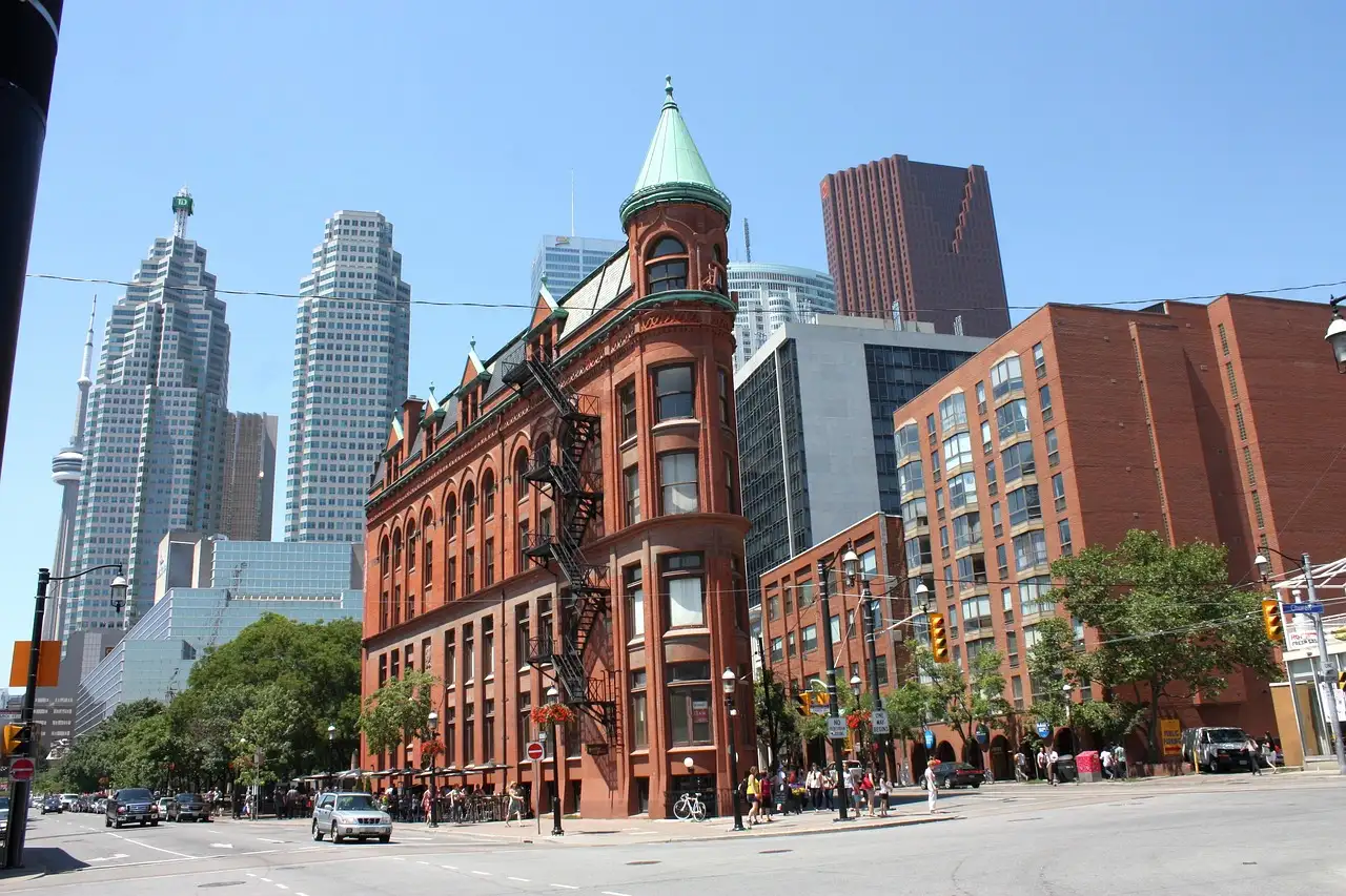 The red-brick Gooderham Building on Front Street, with downtown towers behind it