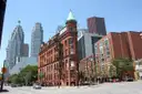 The red-brick Gooderham Building on Front Street, with downtown towers behind it