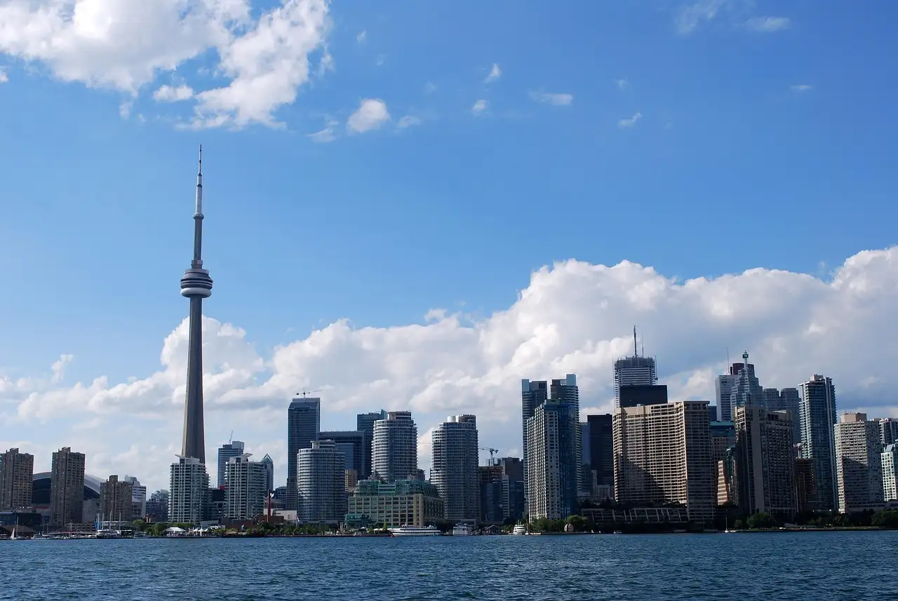 The CN Tower and the downtown Toronto skyline across the water on a sunny day