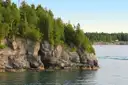 Forest-topped limestone cliffs along the Georgian Bay shore