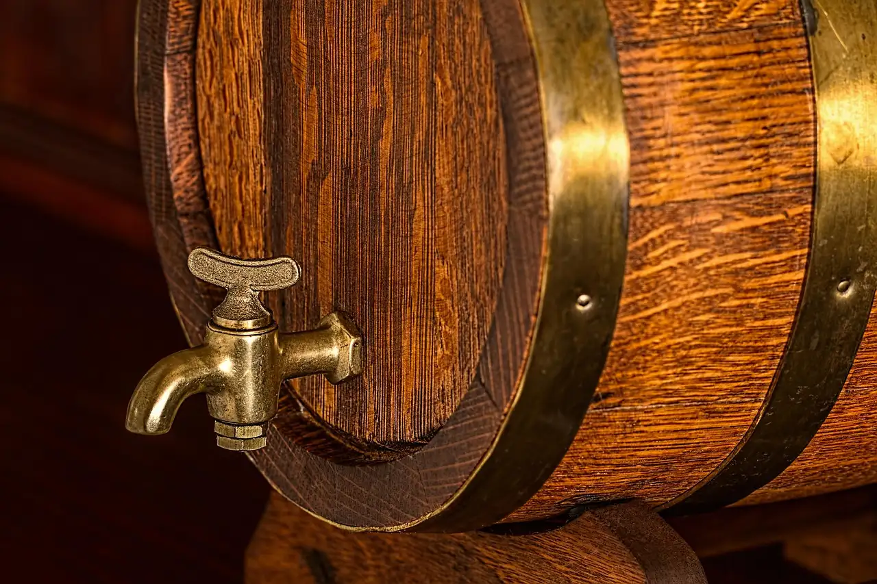 An old oak barrel with a brass tap