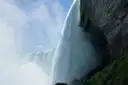 Water pouring over the edge of the Horseshoe Falls, seen from the side