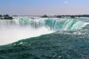 Green water pouring over the edge of the Horseshoe Falls