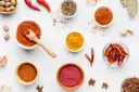 Bowls of ground spices, chilies and star anise