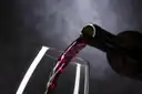 Red wine being poured into a glass