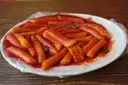 A plate of Korean rice cakes in red chili sauce